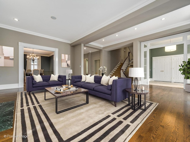 living area with stairs, ornamental molding, baseboards, a chandelier, and wood finished floors
