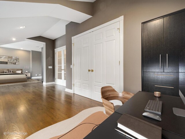 office area featuring french doors, baseboards, wood finished floors, recessed lighting, and vaulted ceiling