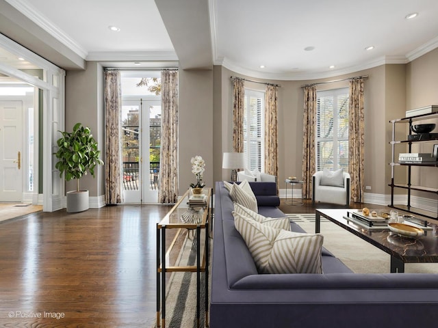 living room featuring baseboards, ornamental molding, wood finished floors, and recessed lighting