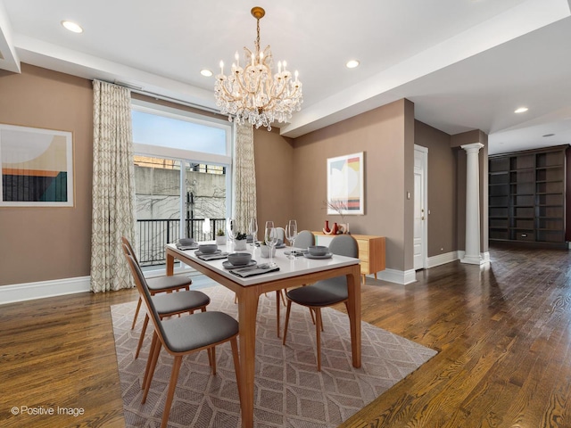 dining room with a chandelier, baseboards, ornate columns, wood finished floors, and recessed lighting