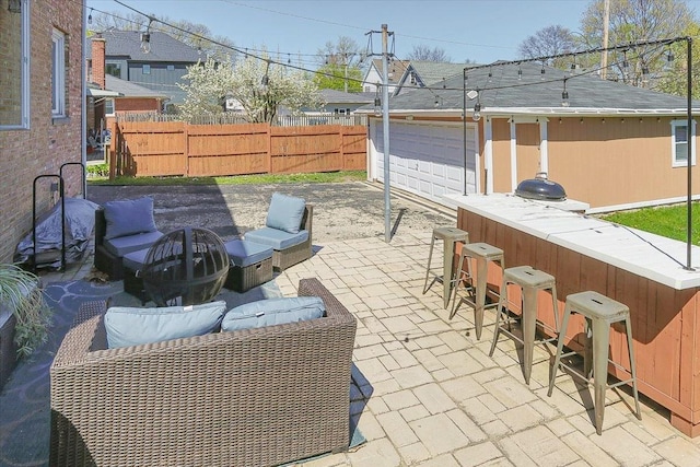 view of patio / terrace with fence and outdoor dry bar