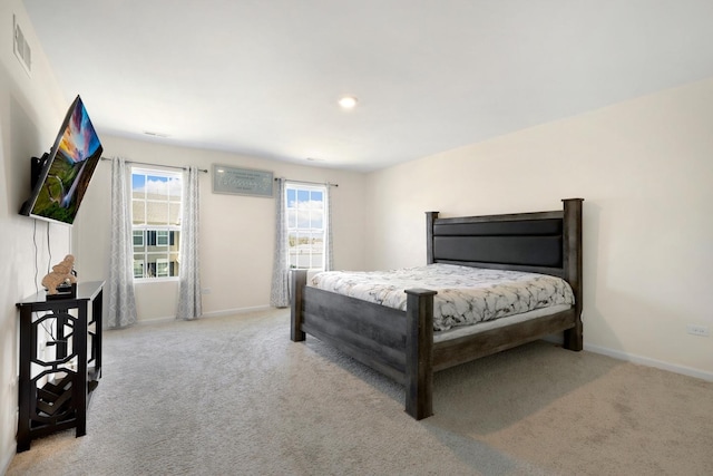 bedroom featuring baseboards, carpet flooring, and visible vents