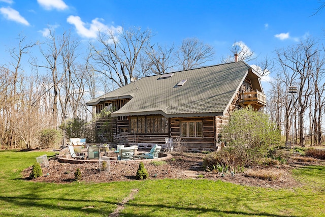 2655 County Road 550 E, Mahomet, IL 61853 - back of property featuring a balcony, a lawn, roof with shingles, and a patio area