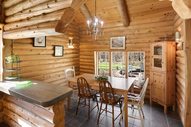 2655 County Road 550 E, Mahomet, IL 61853 - dining room featuring wooden ceiling, a chandelier, vaulted ceiling with beams, rustic walls, and dark tile patterned floors