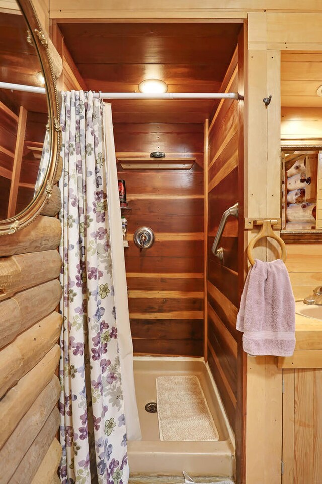 2655 County Road 550 E, Mahomet, IL 61853 - full bath featuring a shower with curtain, wooden walls, and wooden ceiling
