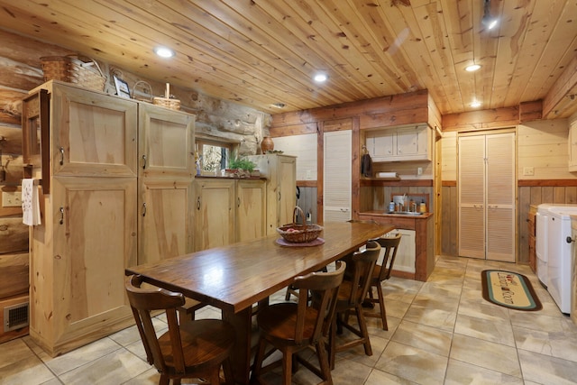 2655 County Road 550 E, Mahomet, IL 61853 - dining space with light tile patterned flooring, wood ceiling, wood walls, washer and dryer, and recessed lighting
