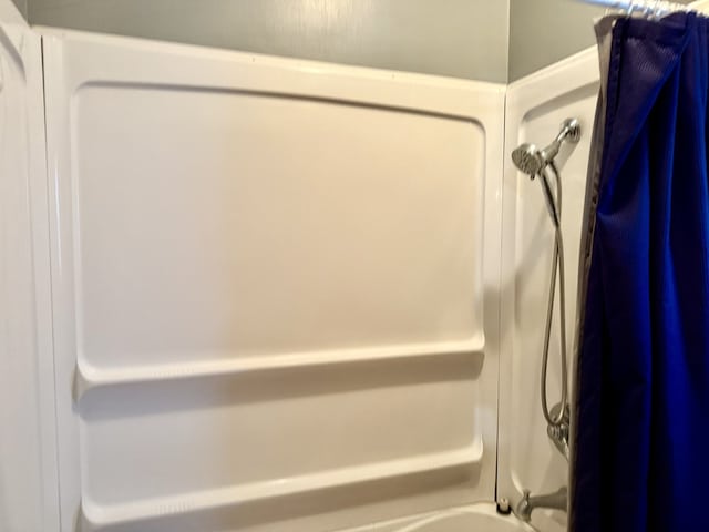 full bathroom with shower / bath combo