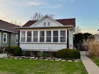 view of side of home featuring a lawn