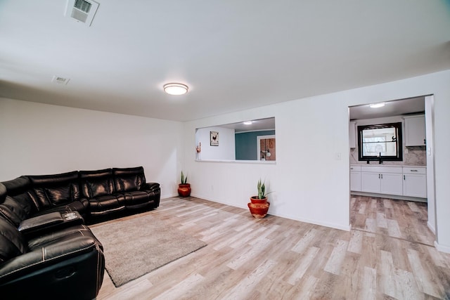 2775 E Riverview Dr, Kankakee, IL 60901 - living room with baseboards, visible vents, and light wood-style floors