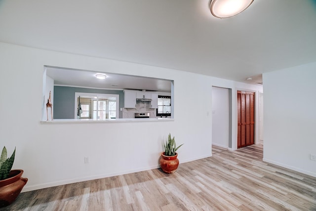 2775 E Riverview Dr, Kankakee, IL 60901 - unfurnished living room featuring baseboards and wood finished floors