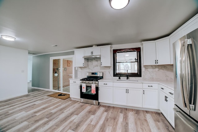 2775 E Riverview Dr, Kankakee, IL 60901 - kitchen featuring under cabinet range hood, a sink, stainless steel appliances, and light wood-style floors