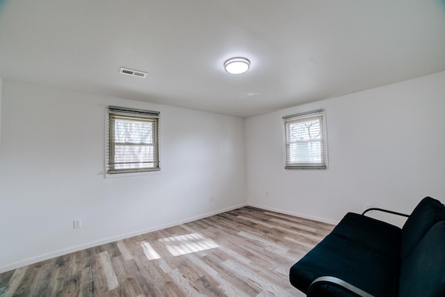 2775 E Riverview Dr, Kankakee, IL 60901 - unfurnished room featuring baseboards, visible vents, and wood finished floors