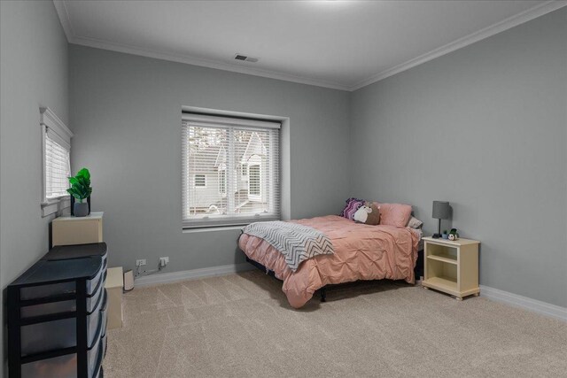 bedroom featuring baseboards, carpet, multiple windows, and visible vents