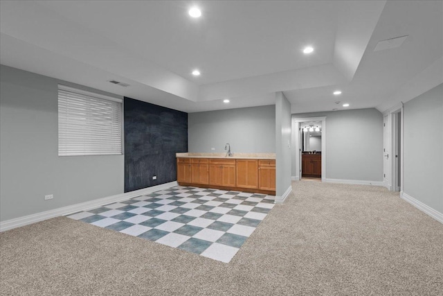 bar featuring recessed lighting, a sink, visible vents, light carpet, and indoor wet bar