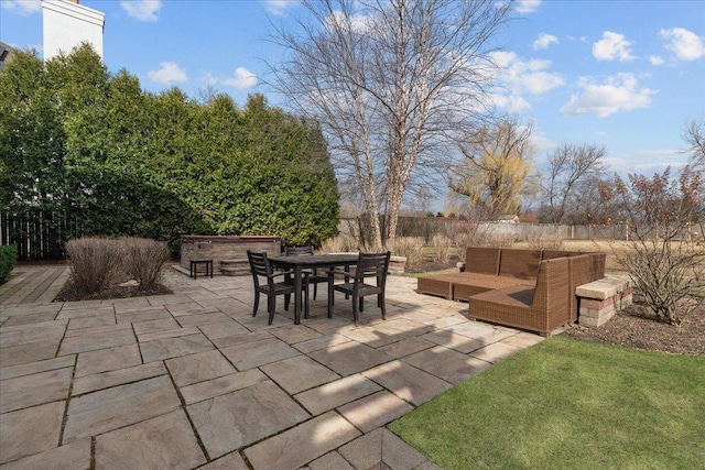 view of patio with outdoor dining area and an outdoor living space
