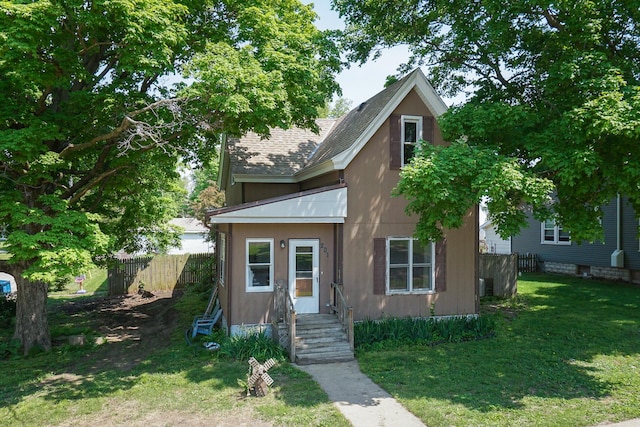 201 E Boundary St, Stanford, IL 61774 - view of front facade featuring a shingled roof and stucco siding