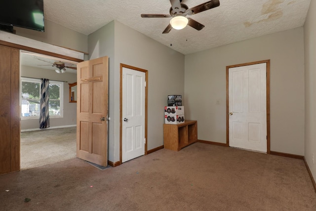 201 E Boundary St, Stanford, IL 61774 - empty room with ceiling fan, carpet, baseboards, and a textured ceiling