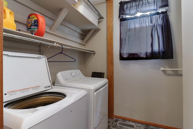 201 E Boundary St, Stanford, IL 61774 - clothes washing area with independent washer and dryer and baseboards