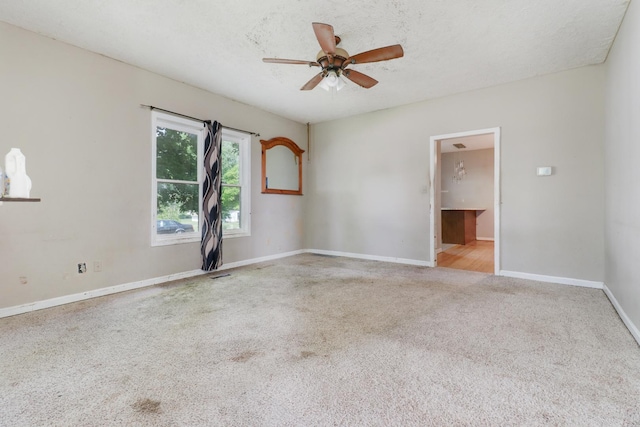 201 E Boundary St, Stanford, IL 61774 - unfurnished room featuring carpet flooring, baseboards, and ceiling fan