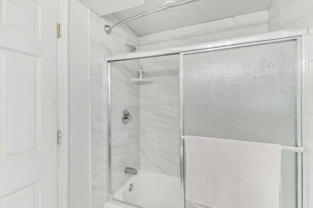 full bathroom featuring bath / shower combo with glass door