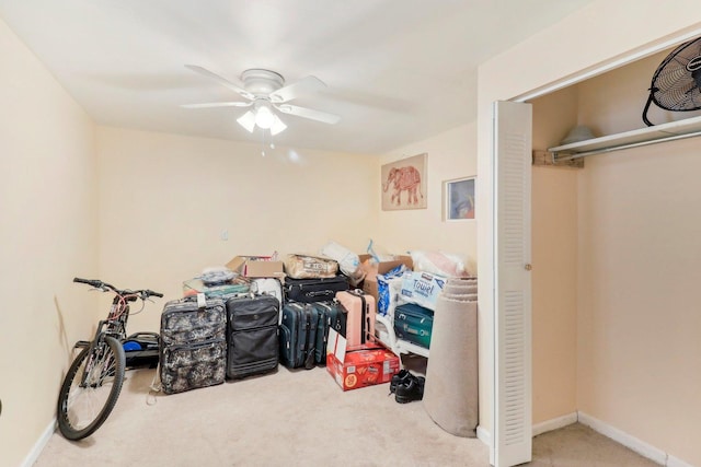 bedroom featuring baseboards, a ceiling fan, and carpet
