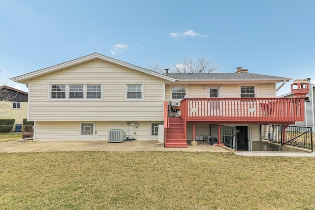 rear view of house with a patio, stairway, central AC, a yard, and a deck