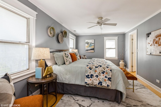 bedroom with wood finished floors, baseboards, ornamental molding, and ceiling fan