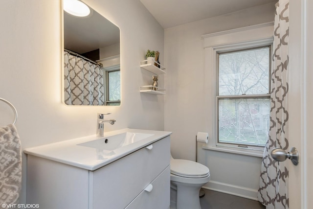 full bathroom featuring vanity and toilet