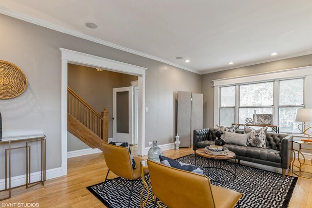 living room with light wood-style flooring, stairs, ornamental molding, baseboards, and recessed lighting