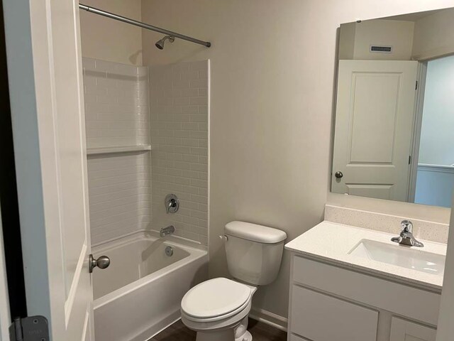 full bath with toilet, vanity, tub / shower combination, and visible vents