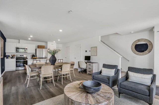 dining room featuring dark wood-type flooring and recessed lighting