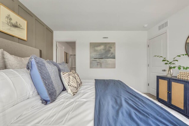 bedroom with carpet flooring and visible vents