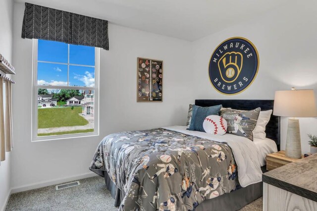 bedroom with carpet flooring, baseboards, and visible vents