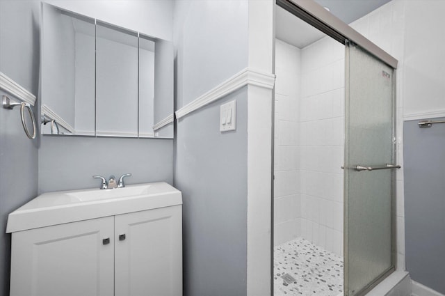 bathroom with vanity and a shower stall