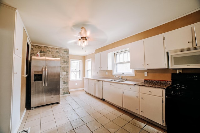 245 E 4th Ave, Clifton, IL 60927 - kitchen featuring light tile patterned flooring, a sink, white appliances, a ceiling fan, and baseboards