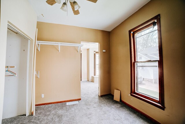 245 E 4th Ave, Clifton, IL 60927 - spare room featuring ceiling fan, visible vents, baseboards, and carpet