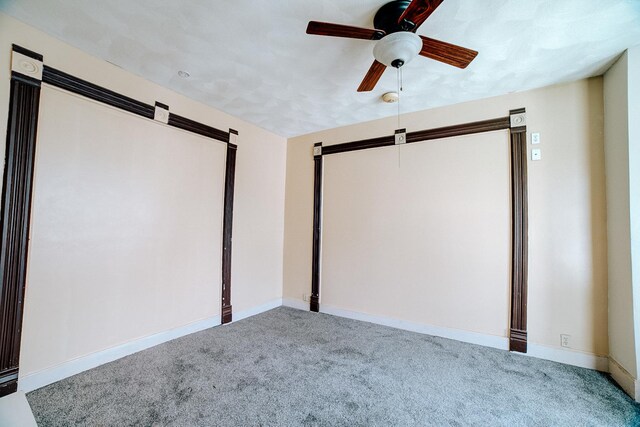 245 E 4th Ave, Clifton, IL 60927 - carpeted home theater room featuring baseboards and ceiling fan