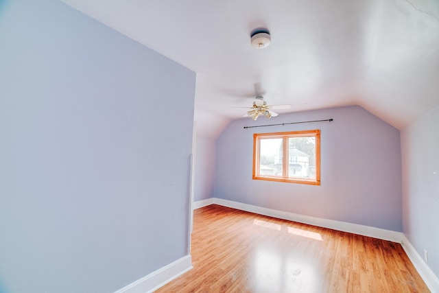 245 E 4th Ave, Clifton, IL 60927 - bonus room with baseboards, wood finished floors, and vaulted ceiling