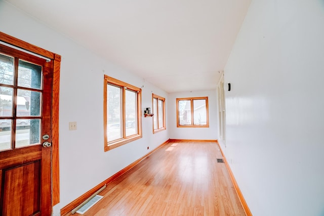 245 E 4th Ave, Clifton, IL 60927 - spare room featuring baseboards, visible vents, and light wood finished floors