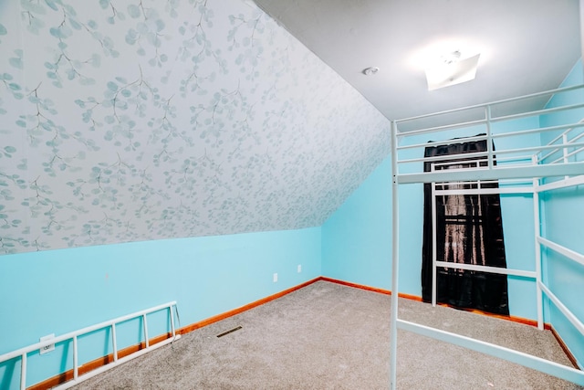245 E 4th Ave, Clifton, IL 60927 - additional living space with carpet floors, baseboards, and lofted ceiling
