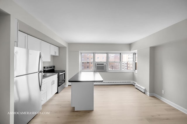 4970 N Marine Dr Unit 526, Chicago, IL 60640 - kitchen featuring white cabinets, appliances with stainless steel finishes, baseboards, and light wood-style flooring