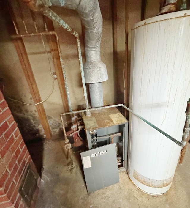 321 1st St, Bradford, IL 61421 - utility room featuring water heater