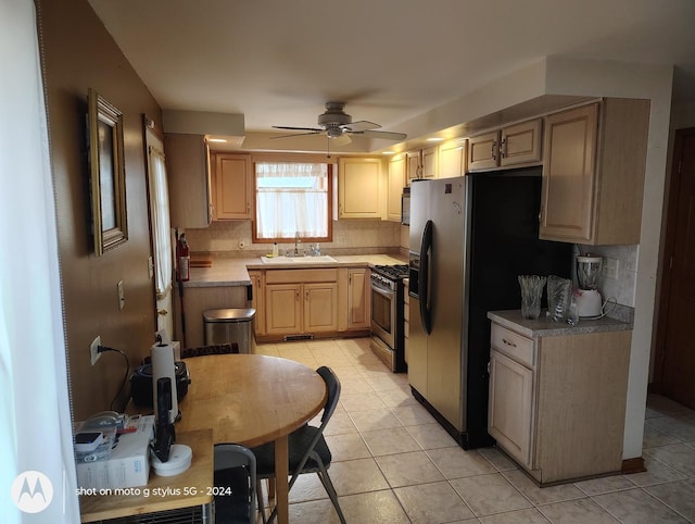 8550 S Avalon Ave, Chicago, IL 60619 - kitchen featuring stainless steel appliances, a ceiling fan, tasteful backsplash, and light tile patterned floors