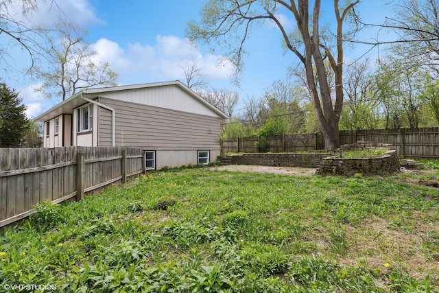 view of yard with a fenced backyard