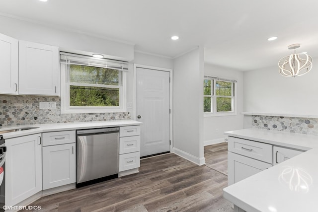 kitchen with stainless steel dishwasher, dark wood-type flooring, white cabinetry, a chandelier, and tasteful backsplash