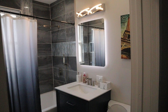 bathroom with shower / bathtub combination with curtain, vanity, and toilet