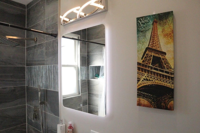 bathroom with a chandelier and a walk in shower