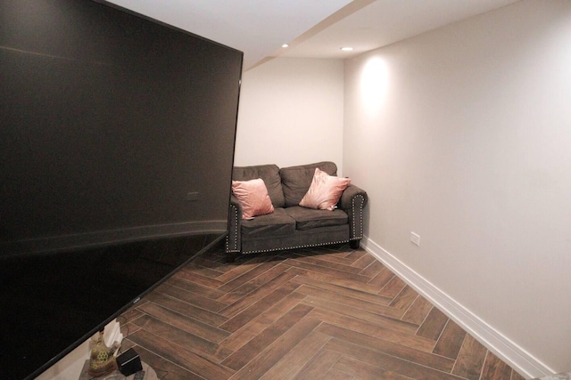 sitting room with baseboards and recessed lighting