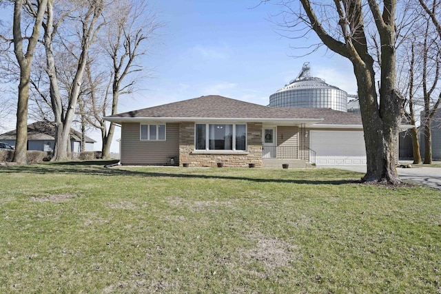 ranch-style home with stone siding, driveway, a front yard, a garage, and a shingled roof