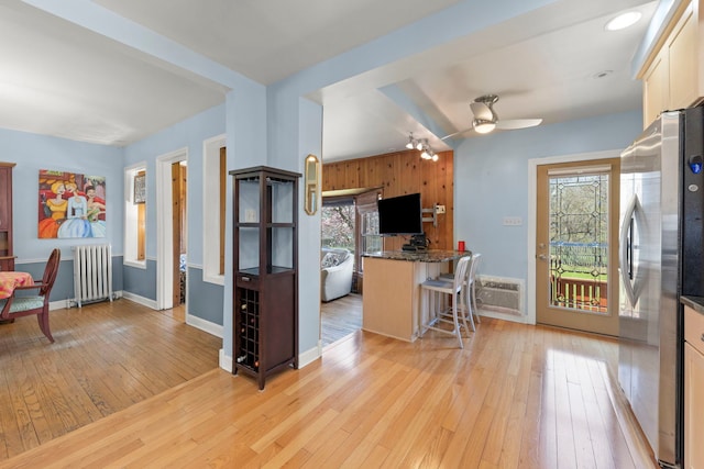 17864 Gladville Ave, Homewood, IL 60430 - kitchen featuring light wood-type flooring, freestanding refrigerator, a wealth of natural light, and radiator